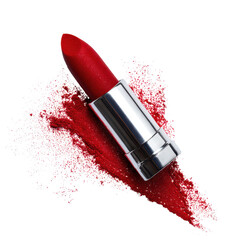 Bright red lipstick lies on a vibrant pile of crushed powder showcasing its rich color and texture in a clean setting