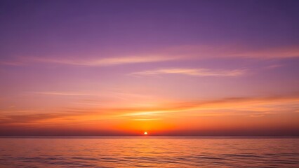 Naklejka premium Beautiful Sunset Over Calm Ocean with Vibrant Purple Orange Sky
