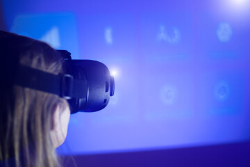 Woman in VR glasses. Virtual reality goggles. Have fun and learning at home. Modern technology concept.
