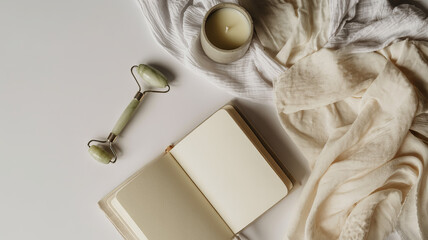 Elevate self-care rituals with a jade roller, journal, and calming candle for ultimate relaxation and mindful moments in a serene, spa-like setting