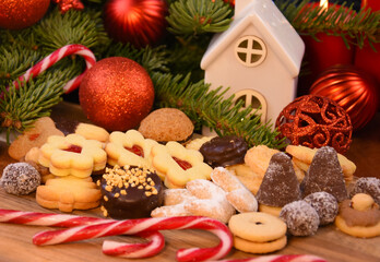 Christmas cookies and christmas decorations on a wooden background stock photo images. Festive shortbread biscuits and linzer cookies photo. Template for background, banner, card
