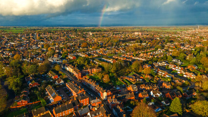 New housing development near existing homes with large construction crane