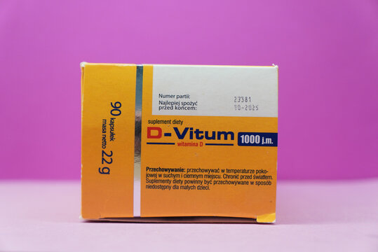 D-Vitum 1000 j.m. Vitamin D Supplement Box on a Pink Background