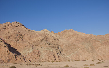 Rocky Desert Mountains Under Clear Blue Sky
