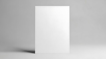 Fototapeta premium Blank vertical white card or poster on simple gray background