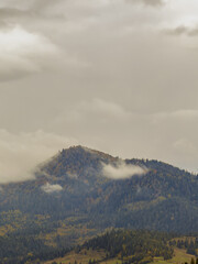 Misty Autumn Rain Clouds over Ukrainian Carpathian Mountains.