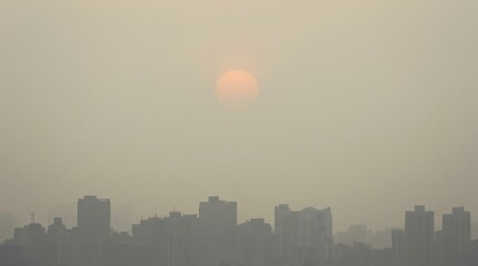City skyline at sunset with hazy atmosphere creating a dramatic scenery over the buildings