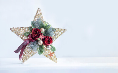 Christmas Star Decoration with Red Roses and Ornaments on White Background