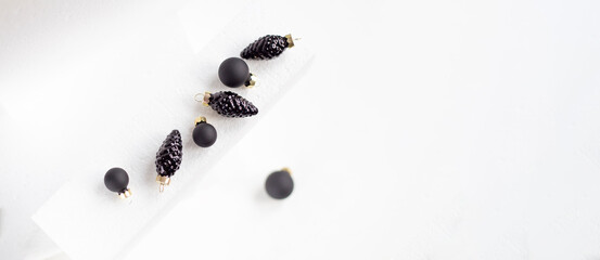 Minimalist Black Christmas Ornaments on White Background