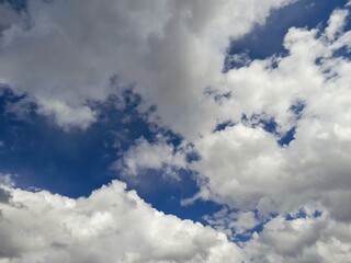 Sky Background: Sunny Clouds Condensing Between Blue Gaps