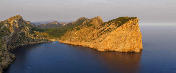 Golden sunset over the cliffs of Cap de Formentor, Mallorca, Spain. Breathtaking Mediterranean landscape with sun rays over the rocky coast — captured in stunning high resolution.