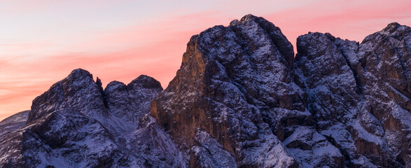 Panoramic view of Dolomite mountain peaks in beautiful morning light. Early winter scene with snow-covered summits, captured in high resolution — perfect for large fine art prints.