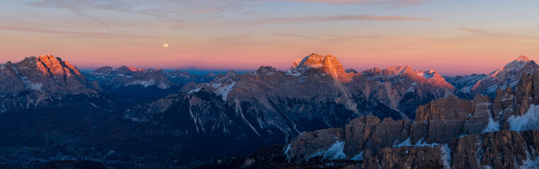 Panoramic view of Dolomite mountain peaks in beautiful morning light. Early winter scene with...