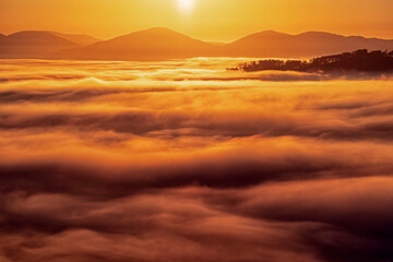 Sunrise in the Blue Ridge Mountains with a view overlooking valley fog.