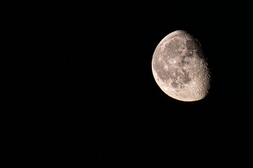 Waxing gibbous Moon against dark night sky