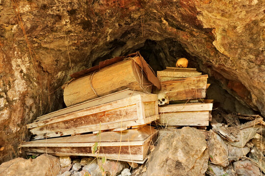 Cave filled with wooden coffins and skulls in the Echo Valley, close to the hanging coffins of Sagada, Luzon, Philippines