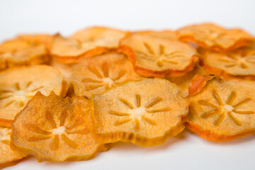 Dried persimmon slices. Selective focus. 