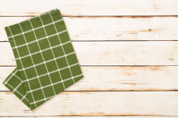 Kitchen napkin on wooden background, top view