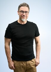 Happy older good looking casual man at home, smiling. Portrait of mid adult, mature age man in glasses, Isolated on white.