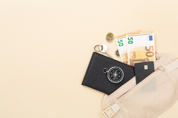 Traveler organizer bag with passport and accessories on color background, top view