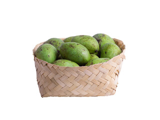 Fresh raw green mangoes in woven bamboo basket isolated on transparent background, organic tropical fruit harvest.
