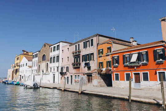 Venice canal with historical buildings and moored boats