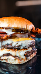 Double deck burger with crispy bacon, rare beef patties, melted cheese, and homemade mayo. Juicy, crunchy, and indulgent. Perfect for gourmet promotions.