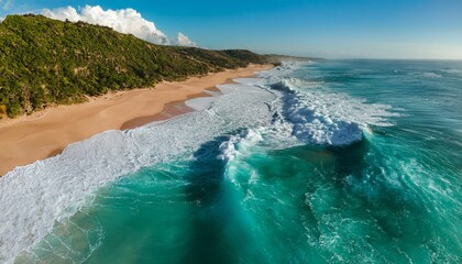 Aerial View Of Turquoise Ocean Waves Crashing On A Sandy Beach