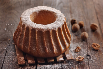 Potica - traditional Slovenian bread cake. Sweet bread roll stuffed with walnuts and sprinkle with sugar