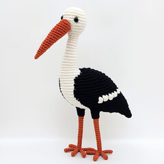 A delightful handmade bird amigurumi, charming and crafted with intricate details