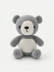 A cute and cuddly handmade crocheted bear doll with a friendly appearance, made with yarn. This bear is perfect for nursery decor and for kids who love stuffed animals