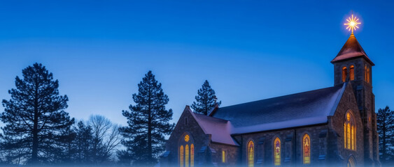 Historic stone church with glowing stained glass windows and a Bethlehem star on its spire, illuminated at night during the Christmas season for holiday designs. Banner with copy space