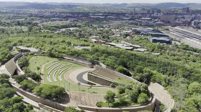 Drone orbits to the right on the south side of the top of Freedom Park museum on sunny day in Pretoria, South Africa