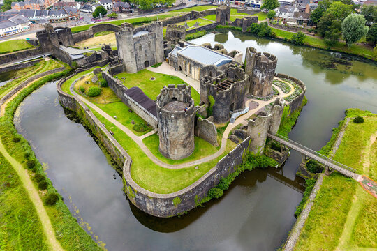 Historic medieval Caerphilly Castle and its extensive moat seen from above, Wales.