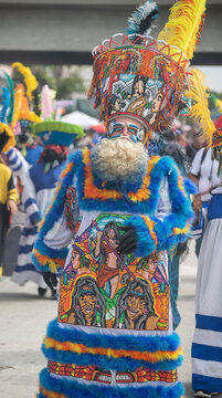Chinelos wearing a costume to satirize European colonizers of Mexico