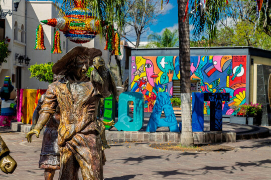 Tlaquepaque, Mexico &ndash; January 12, 2025: El grito continua sculpture detail with bronze figure and pinata in historic center