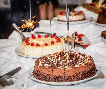chocolate and vanilla birthday cake with sparkler