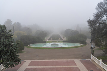 Great fountain of the large park, Jose Antonio Labordeta from Zaragoza on a foggy day