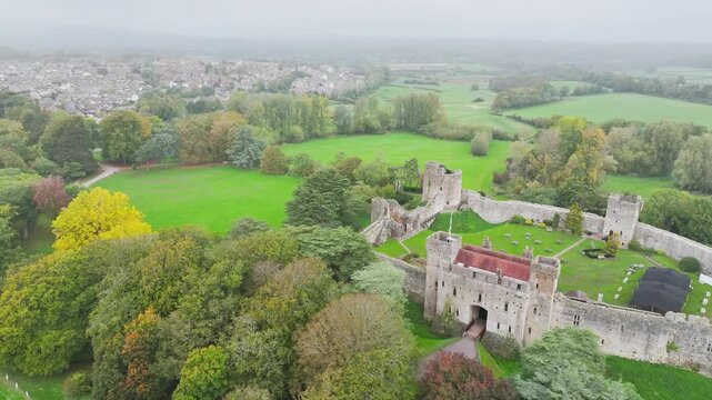 Autumn Colours over ruins of Caldicot Castle from a drone, Caldicot, Monmouthshire, Wales, UK