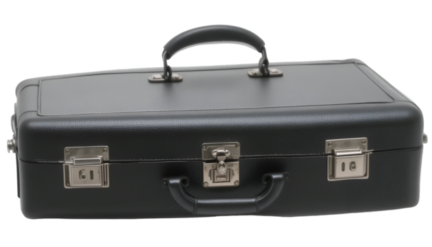 A close up shot of a black hard sided briefcase with metal latches and a handle on a dark surface