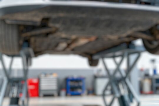 BLur background of Modern car on a lift at a service station