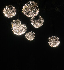 Glowing Christmas lights shining in the dark.