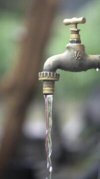 water flowing from a faucet, water flowing from a tap in a farmhouse