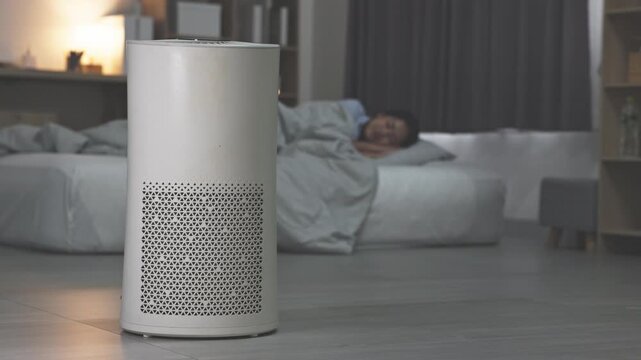 Asian air purifier bedroom sleep night device modern white cylinder quiet filtration improving air quality for restful sleep portable air cleaner creating peaceful comfortable sleep environment with