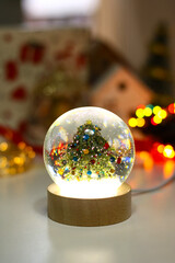 Magical Christmas glass ball with sparkling fairy lights