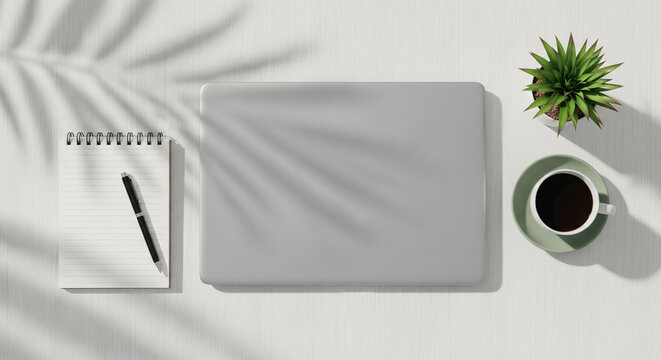 Top view of modern minimalist workspace with laptop and coffee cup on white desk, flat lay business concept with copy space.