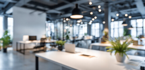 Modern open space office interior with blurred background, featuring plants, desks, and ambient lighting, creating vibrant work environment