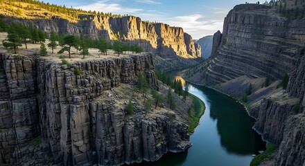 Beautiful natural landscape of a river flowing through a rugged canyon during a golden hour sunset