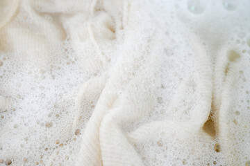 Cashmere Wool Sweater Being Hand Washed with Delicate Detergent
