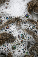 Cashmere Wool Sweater Being Hand Washed with Delicate Detergent